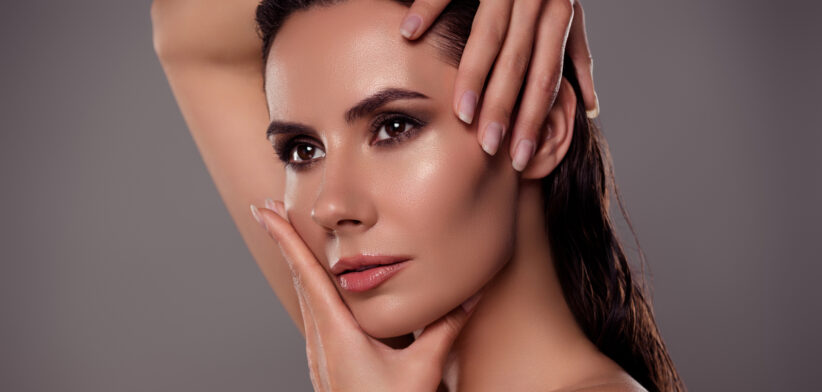 Photo portrait of pretty young girl touch head hands pampering spa salon isolated on dark gray color background