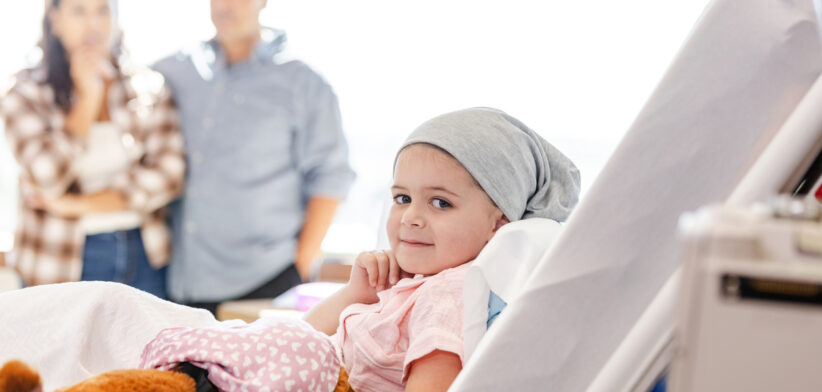 Young cancer patient in hospital bed