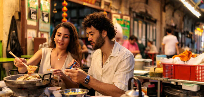 Couple enjoying a cozy hot pot dinner side by side