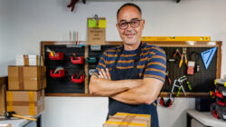 Smiling Owner of Small Business Looking At Camera