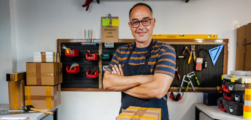 Smiling Owner of Small Business Looking At Camera