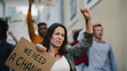 Group of people activists protesting on streets, strike and demonstration concept.