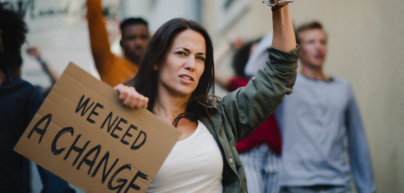 Group of people activists protesting on streets, strike and demonstration concept.