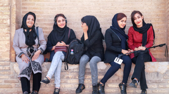 beautiful local girls smiling at the old bridge in Esfahan.