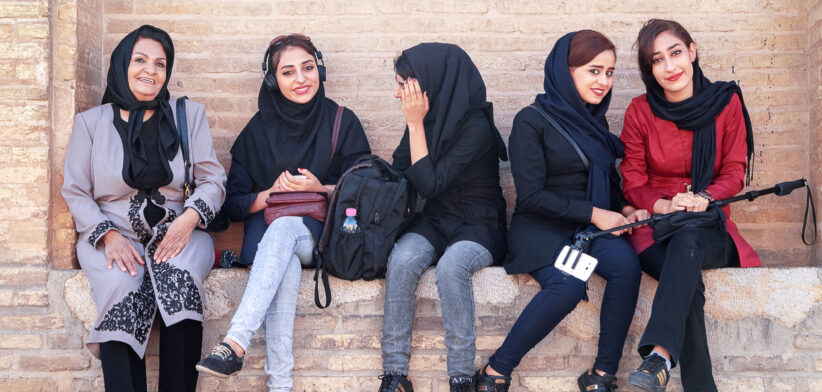beautiful local girls smiling at the old bridge in Esfahan.