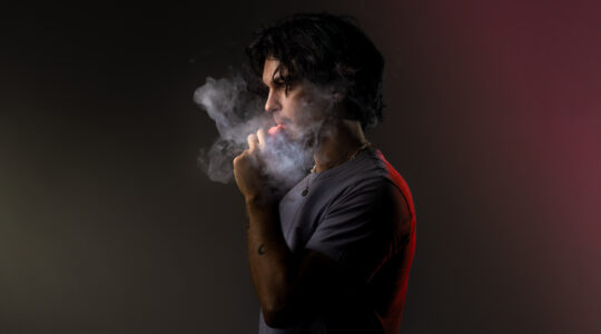 Young Adult Using Disposable Vape