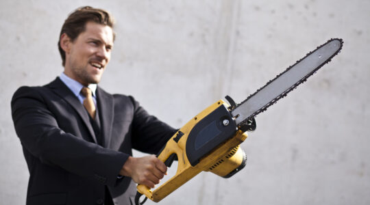 Man in suit with chainsaw