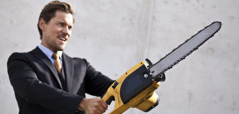 Man in suit with chainsaw