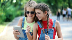 Two girls looking at a tablet