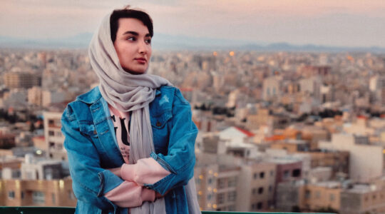 Full Length Of Woman Standing Against Buildings In City