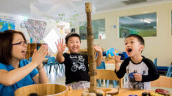 Preschooler_playing_stacking_recycled_diverse3