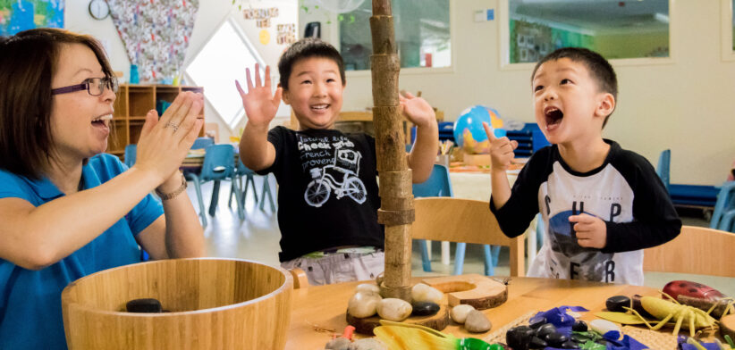 Preschooler_playing_stacking_recycled_diverse3