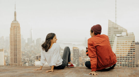 Rear view of couple embracing in New York