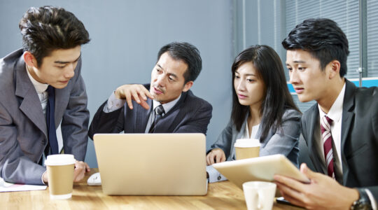 team of asian business people meeting in office