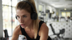 Sporty woman working out with exercise bike