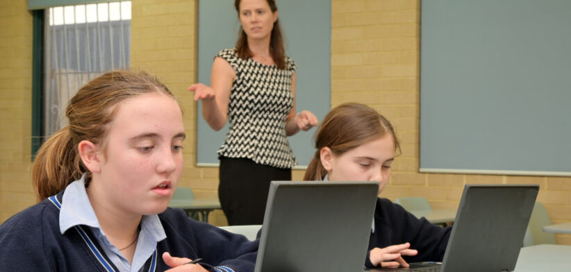 Teacher teaching Technology in classroom