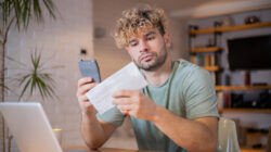 Young man going through paperwork