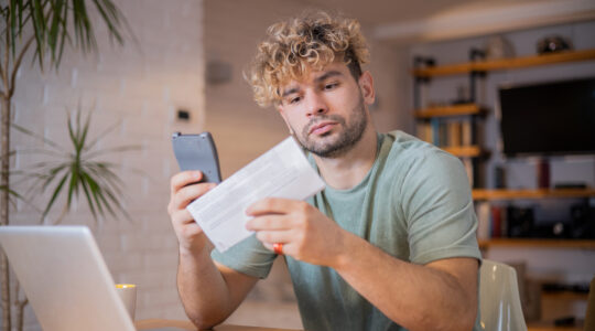 Young man going through paperwork