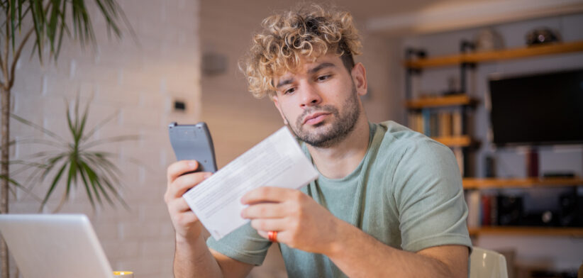 Young man going through paperwork