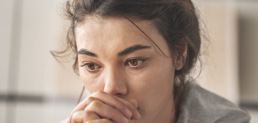 Sad young woman dealing with loss and psychological trauma