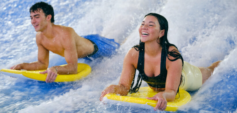 Young Adults Surfing in an Indoor Facility