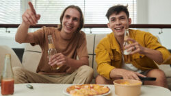 Young Men Watching Game at Home