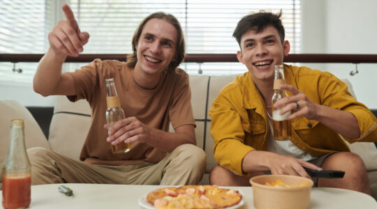 Young Men Watching Game at Home