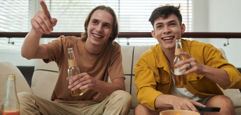 Young Men Watching Game at Home