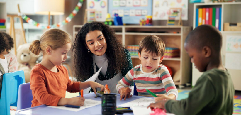 Drawing, education and teacher with children in classroom for learning, students and creative art. Growth, kindergarten and academy with woman and kids at school for helping and child development