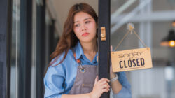 Small business owner closing cafe from financial crisis