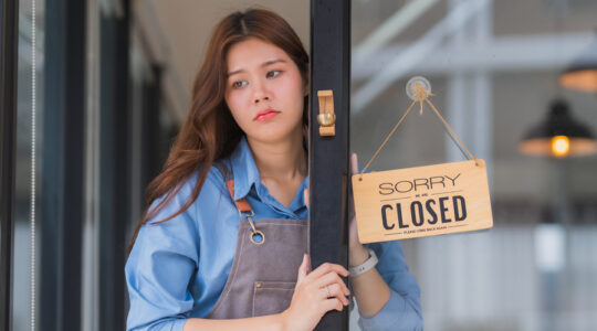 Small business owner closing cafe from financial crisis