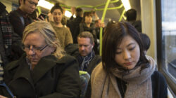Commuters on metro train in Melbourne, Australia