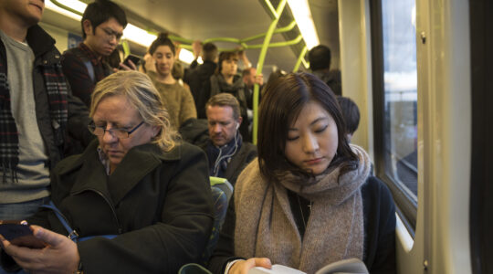 Commuters on metro train in Melbourne, Australia