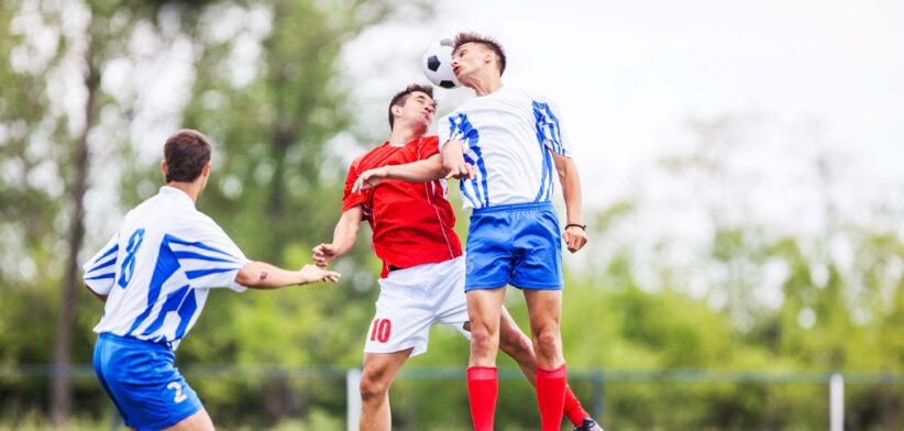 Soccer players heading the ball. | Newsreel