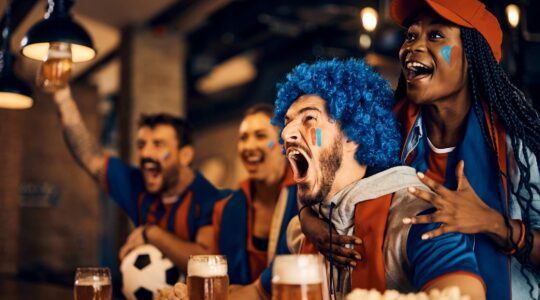 Fans watching soccer in pub