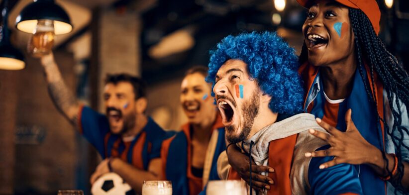 Fans watching soccer in pub