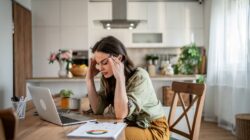 Stressed woman working from home.