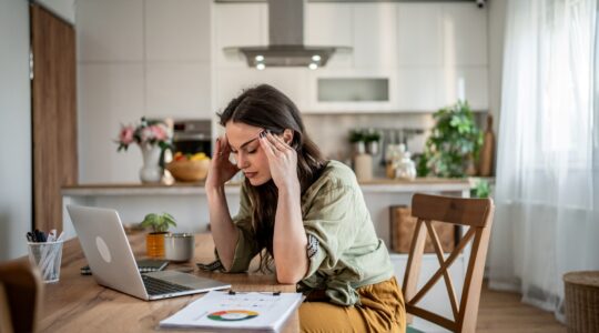 Stressed woman working from home.