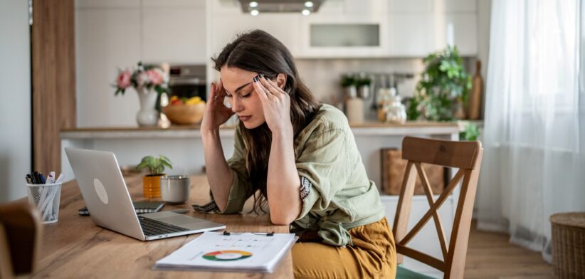 Stressed woman working from home.