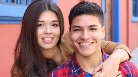 Young couple cuddling close up