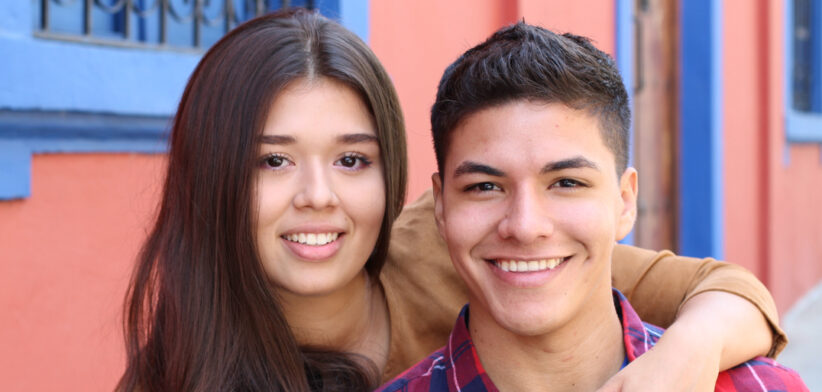 Young couple cuddling close up