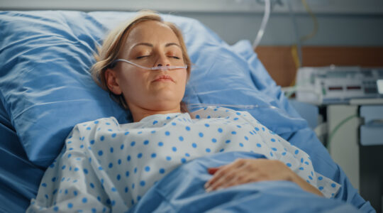 Hospital Ward: Portrait of Beautiful Young Woman Sleeping in Bed, Fully Recovering after Sickness. Female Patient Dreaming About Her Happy Healthy Future.