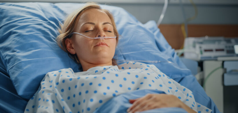 Hospital Ward: Portrait of Beautiful Young Woman Sleeping in Bed, Fully Recovering after Sickness. Female Patient Dreaming About Her Happy Healthy Future.