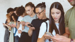 Group of students using mobile phones
