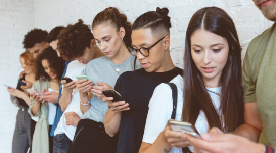 Group of students using mobile phones