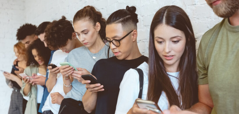 Group of students using mobile phones