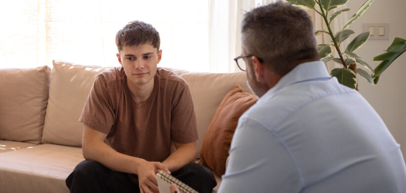 Young man in therapy with his psychologist