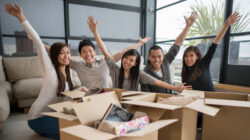 Happy roommates moving house