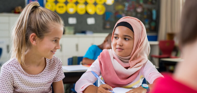 Muslim girl with her classmate