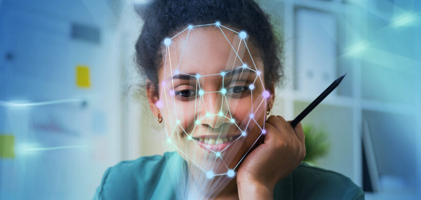 Woman with laptop, face recognition